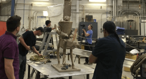 Walla Walla Foundry Workshop staff looking at sculpture on table